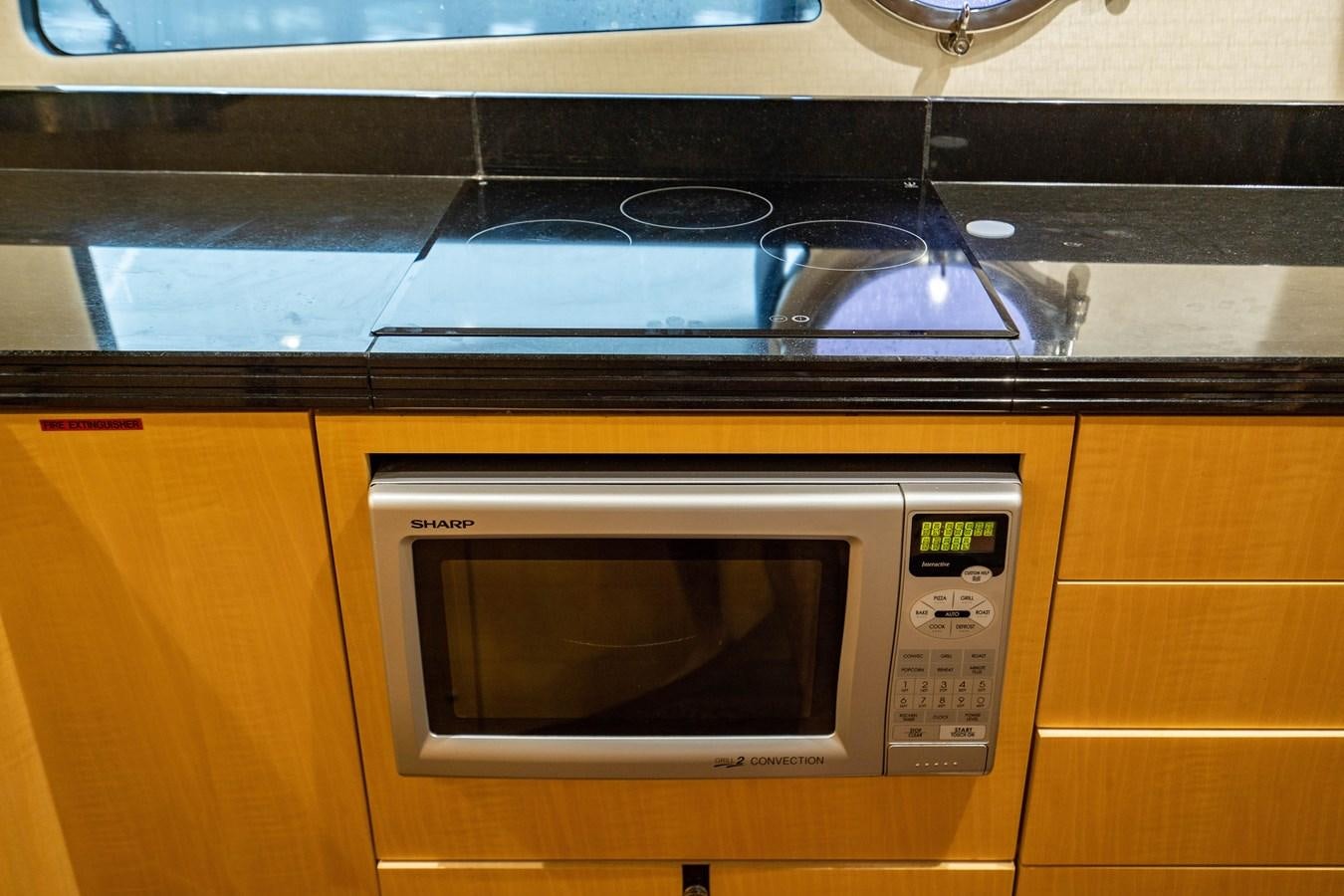 a microwave oven with a stove aboard YOLO Yacht for Sale
