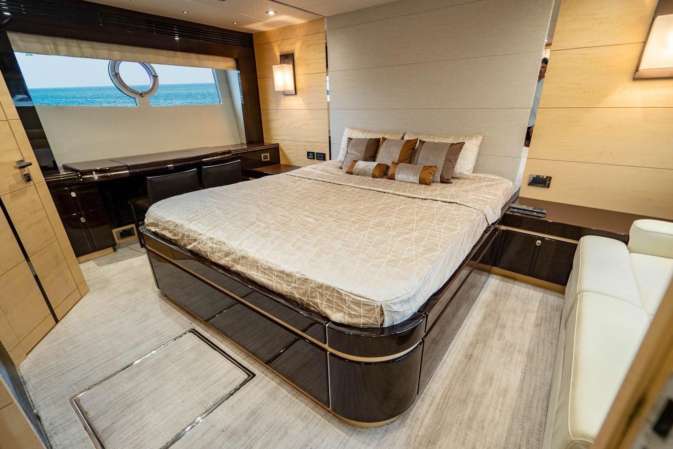 a large bed in a room aboard YOLO Yacht for Sale