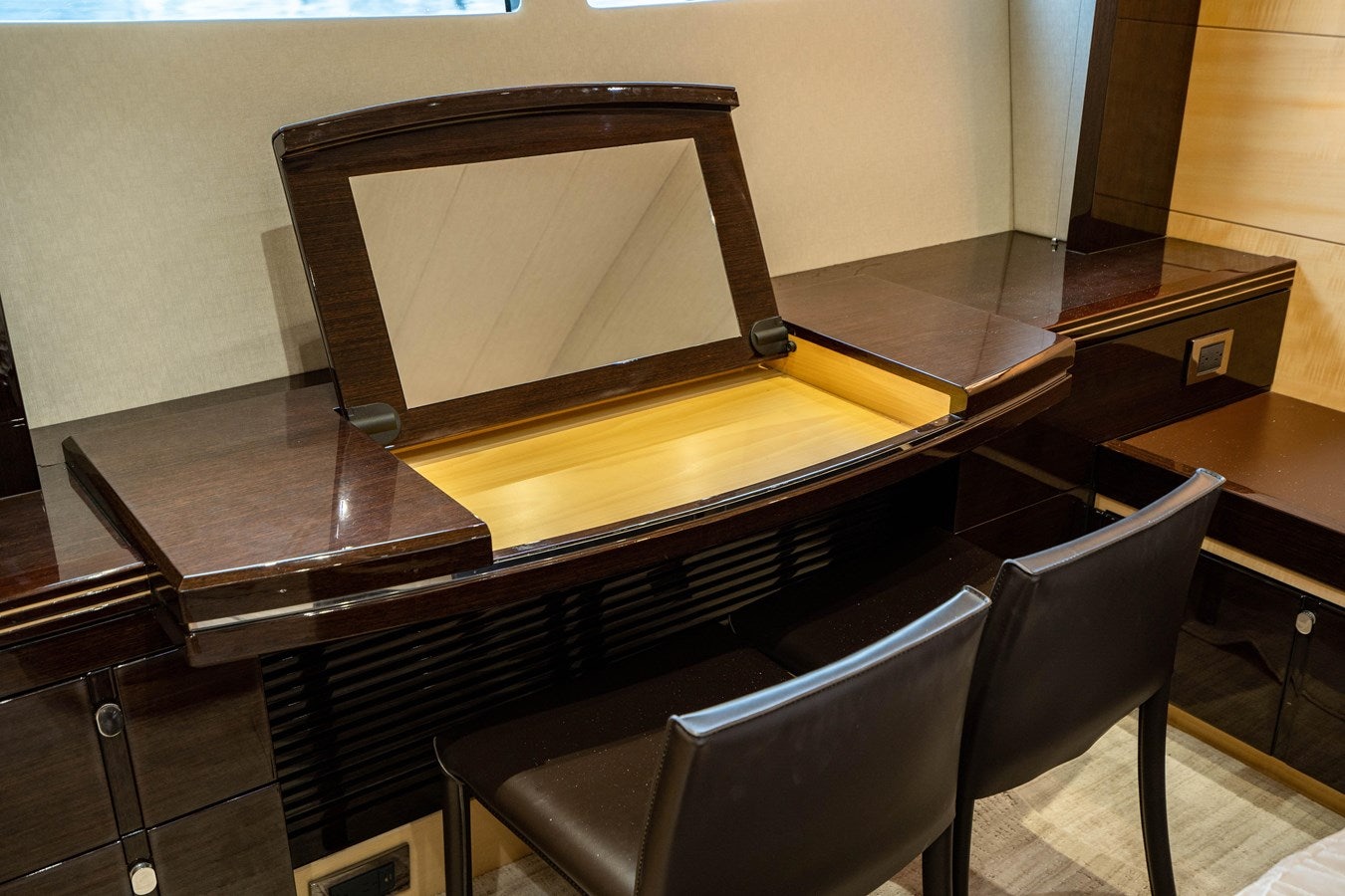 a tv on a table aboard YOLO Yacht for Sale