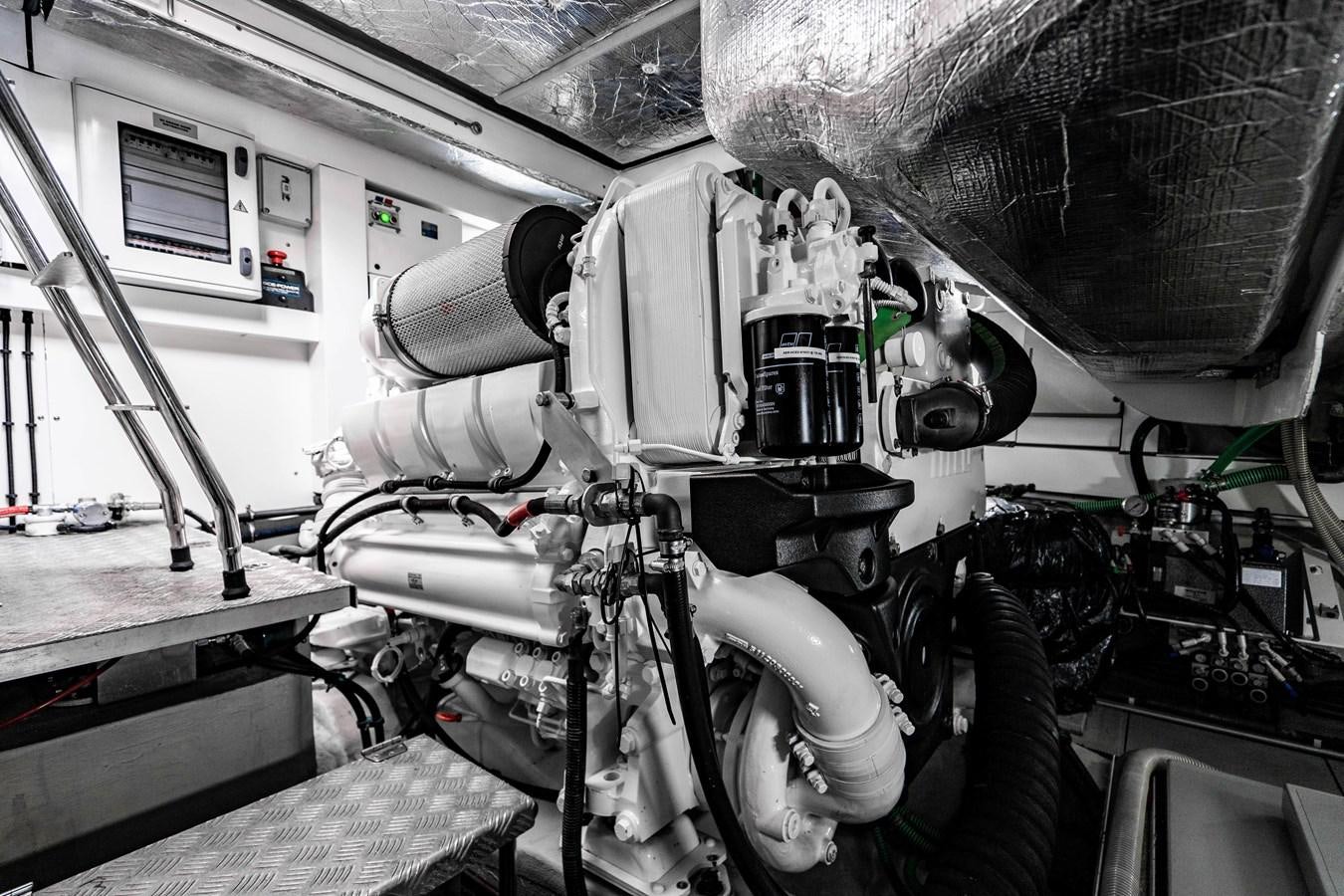 a close-up of a car engine aboard YOLO Yacht for Sale