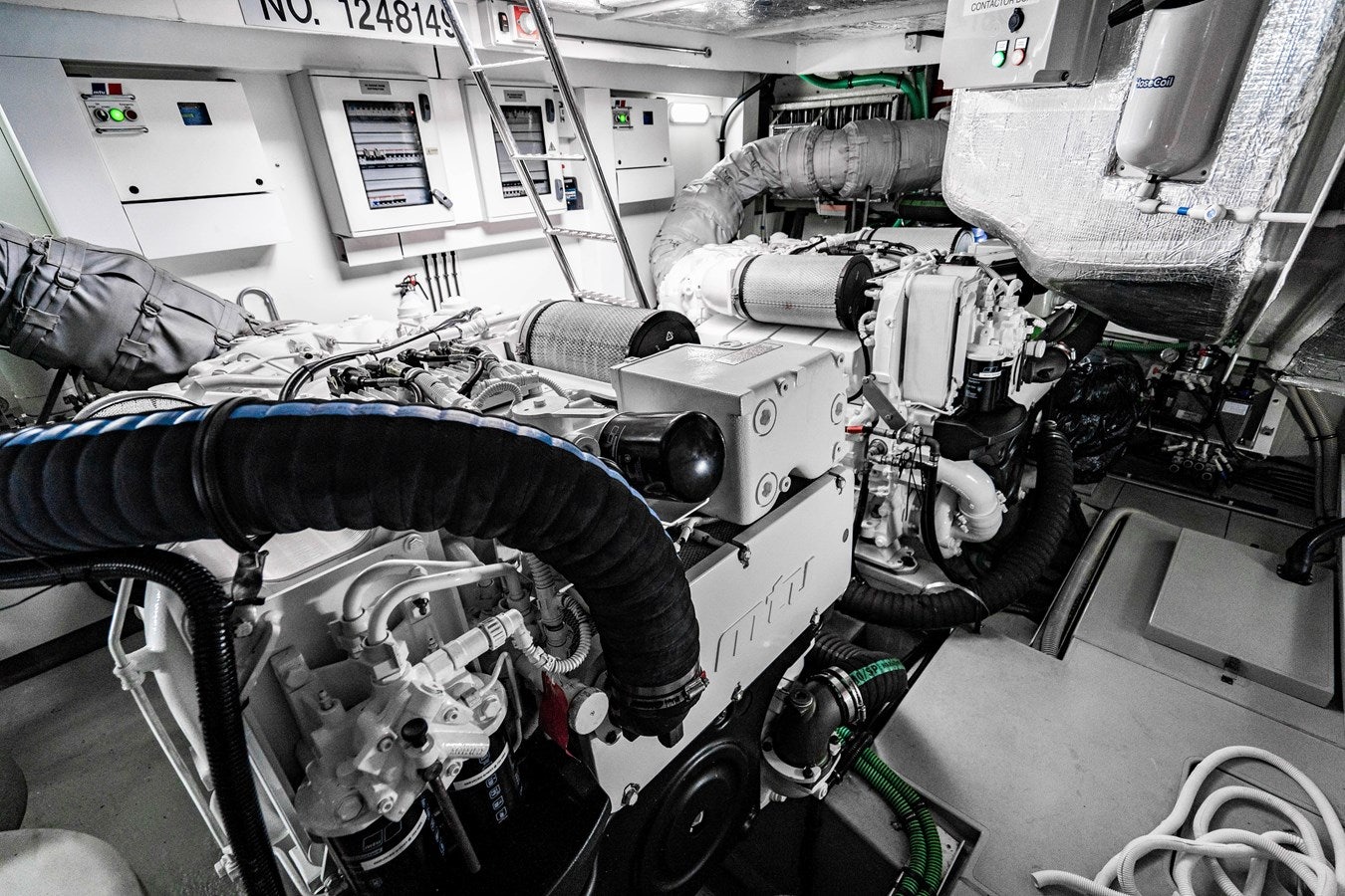 a machine with a person lying on it aboard YOLO Yacht for Sale