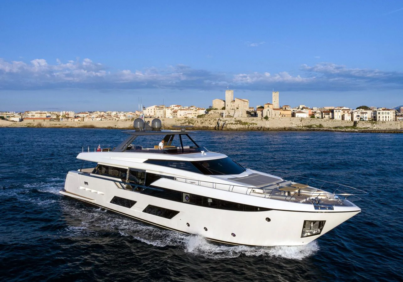 a white yacht in the water aboard L'OPERA Yacht for Sale