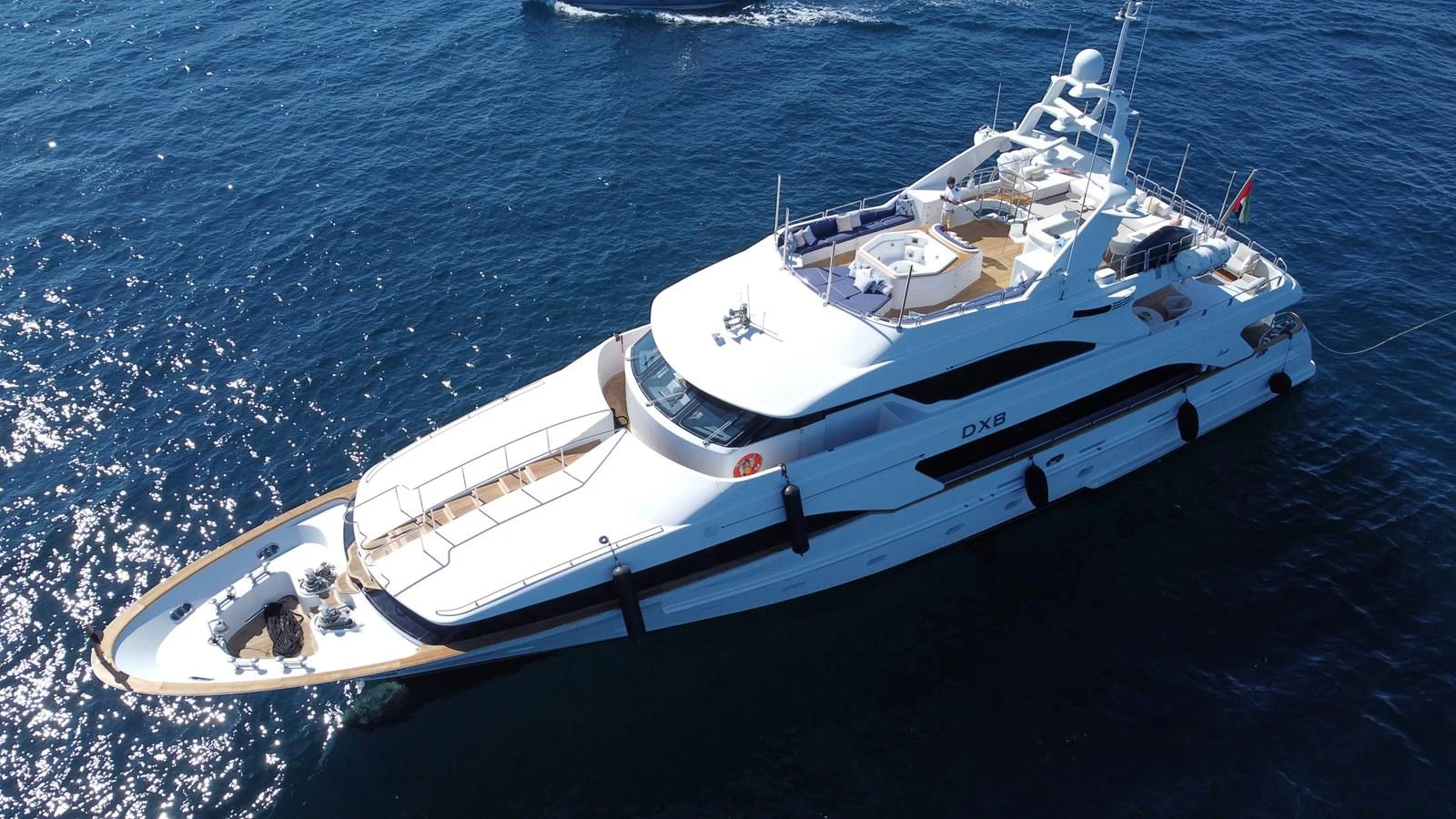 a white yacht on the water aboard DXB Yacht for Sale