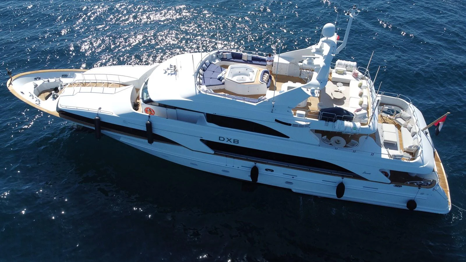a white yacht in the water aboard DXB Yacht for Sale