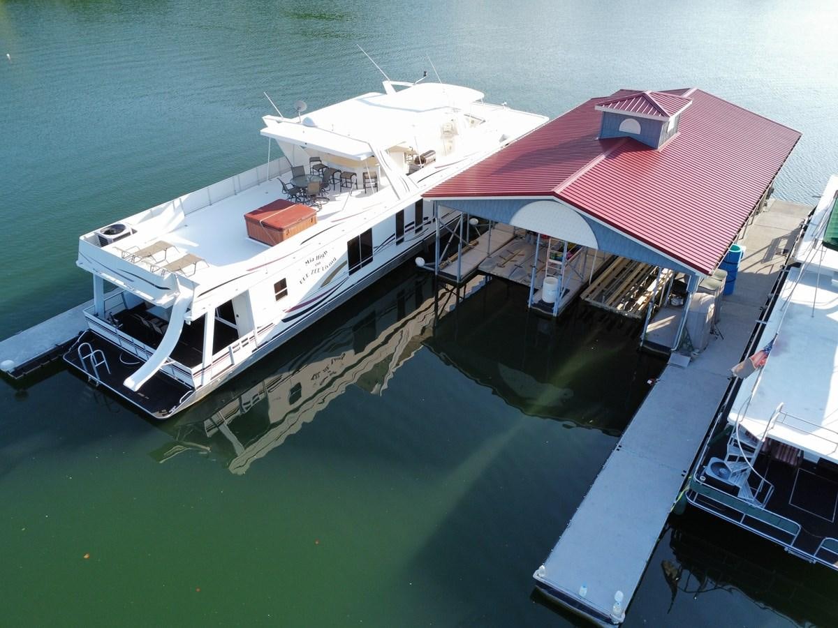 a house on a dock aboard 2007 STARDUST 19 X 86WB NLCG Yacht for Sale