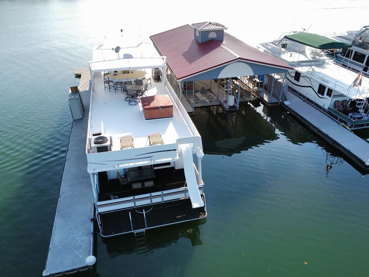 a boat docked at a pier aboard 2007 STARDUST 19 X 86WB NLCG Yacht for Sale