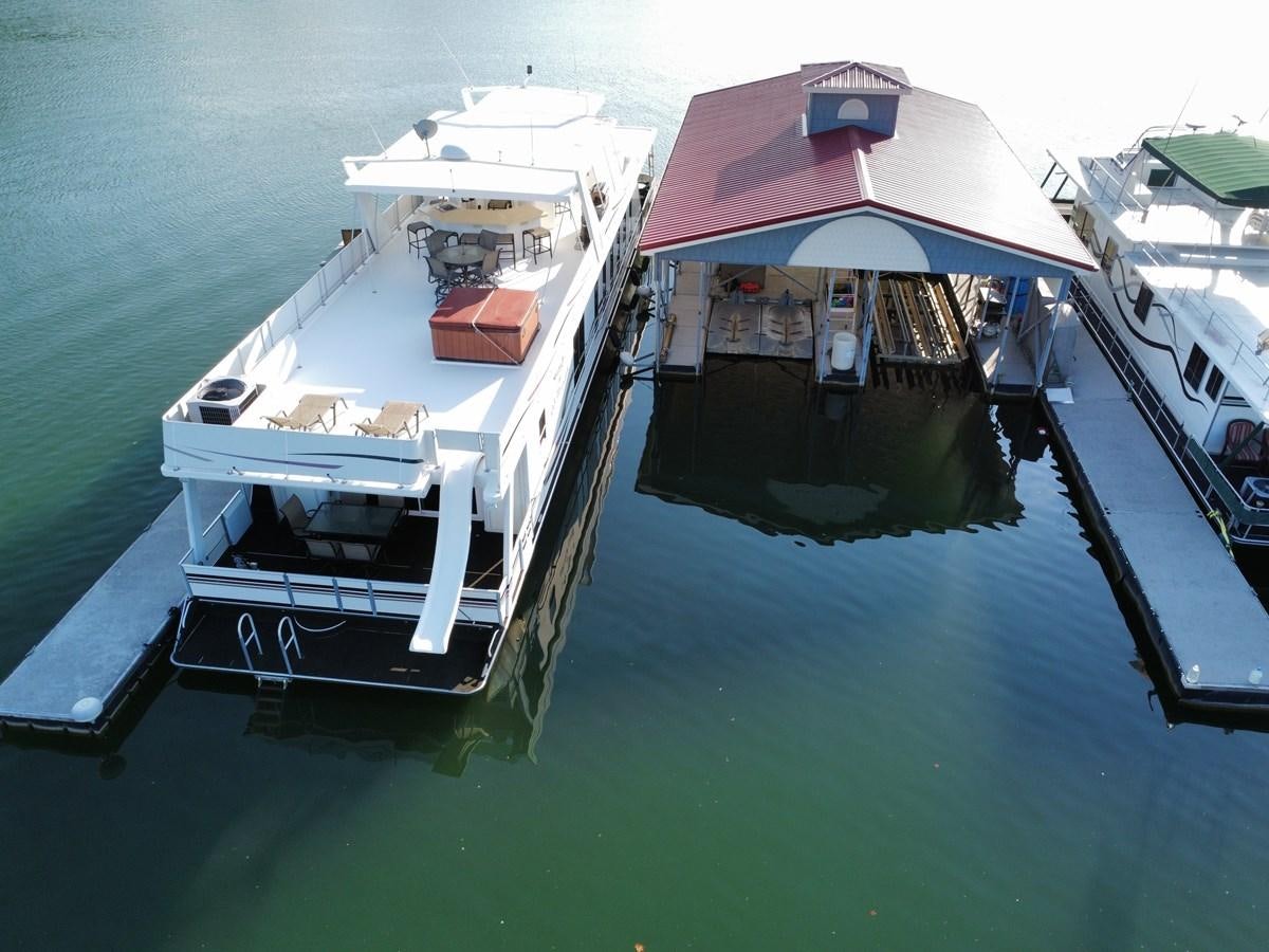 a boat docked at a pier aboard 2007 STARDUST 19 X 86WB NLCG Yacht for Sale