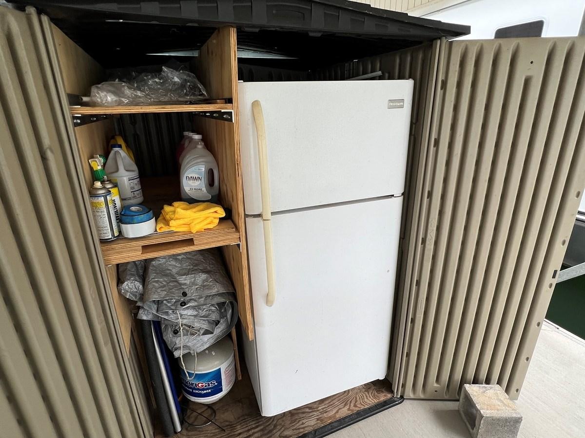 a refrigerator in a kitchen aboard 2007 STARDUST 19 X 86WB NLCG Yacht for Sale
