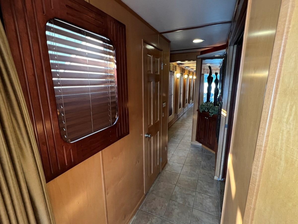 a hallway with wooden doors aboard 2007 STARDUST 19 X 86WB NLCG Yacht for Sale