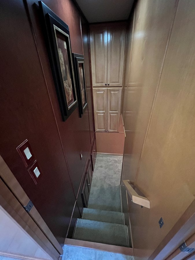 a door with a mirror on the wall aboard 2007 STARDUST 19 X 86WB NLCG Yacht for Sale