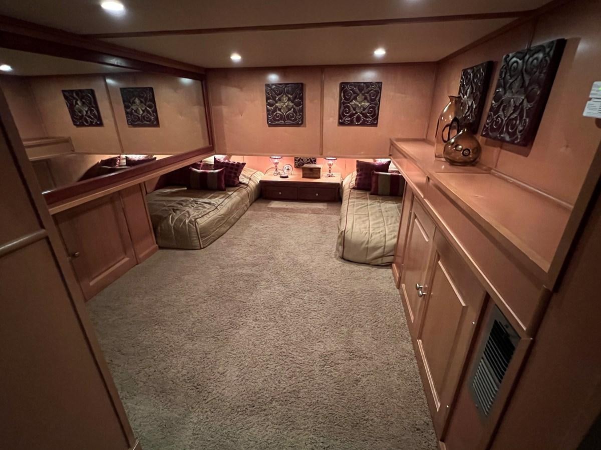 a living room with a couch and a table aboard 2007 STARDUST 19 X 86WB NLCG Yacht for Sale