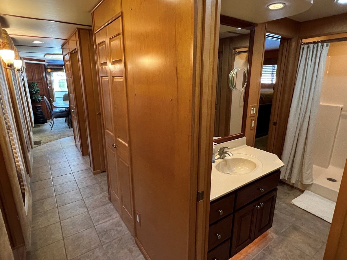 a bathroom with a sink and a mirror aboard 2007 STARDUST 19 X 86WB NLCG Yacht for Sale
