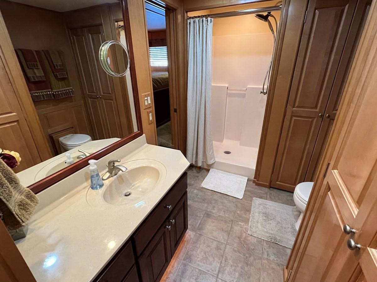 a bathroom with a sink and a shower aboard 2007 STARDUST 19 X 86WB NLCG Yacht for Sale