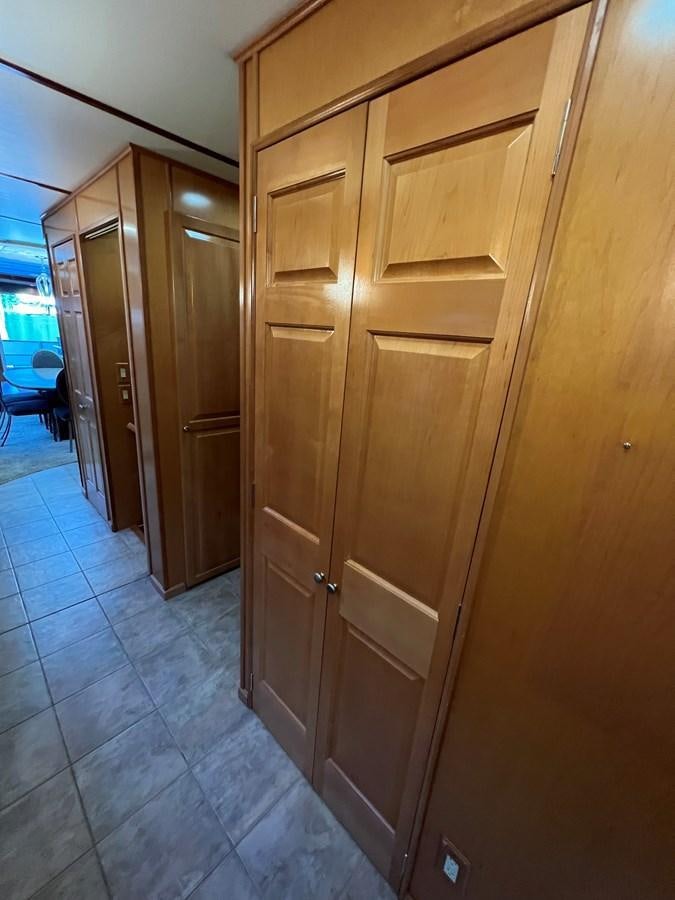 a room with wooden cabinets aboard 2007 STARDUST 19 X 86WB NLCG Yacht for Sale