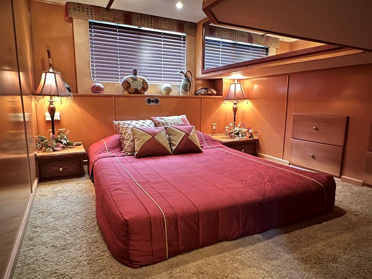 a bed in a room aboard 2007 STARDUST 19 X 86WB NLCG Yacht for Sale