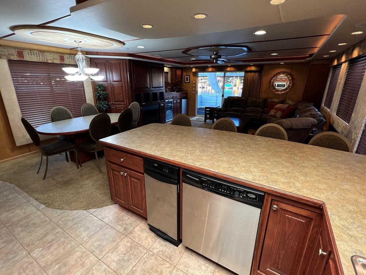 a kitchen and living room area aboard 2007 STARDUST 19 X 86WB NLCG Yacht for Sale