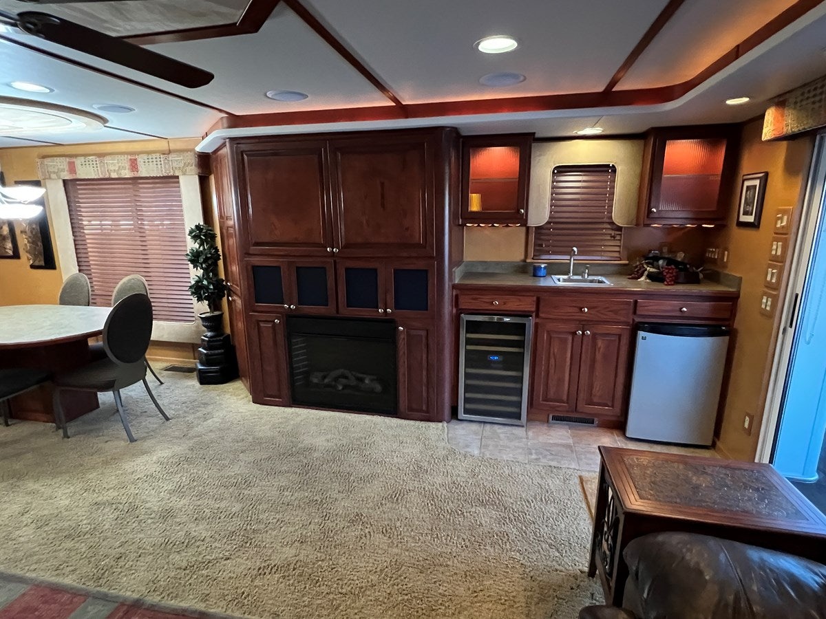 a kitchen with wooden cabinets aboard 2007 STARDUST 19 X 86WB NLCG Yacht for Sale