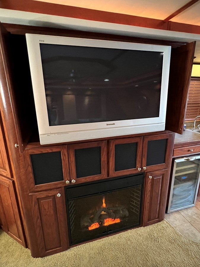 a fireplace in a kitchen aboard 2007 STARDUST 19 X 86WB NLCG Yacht for Sale