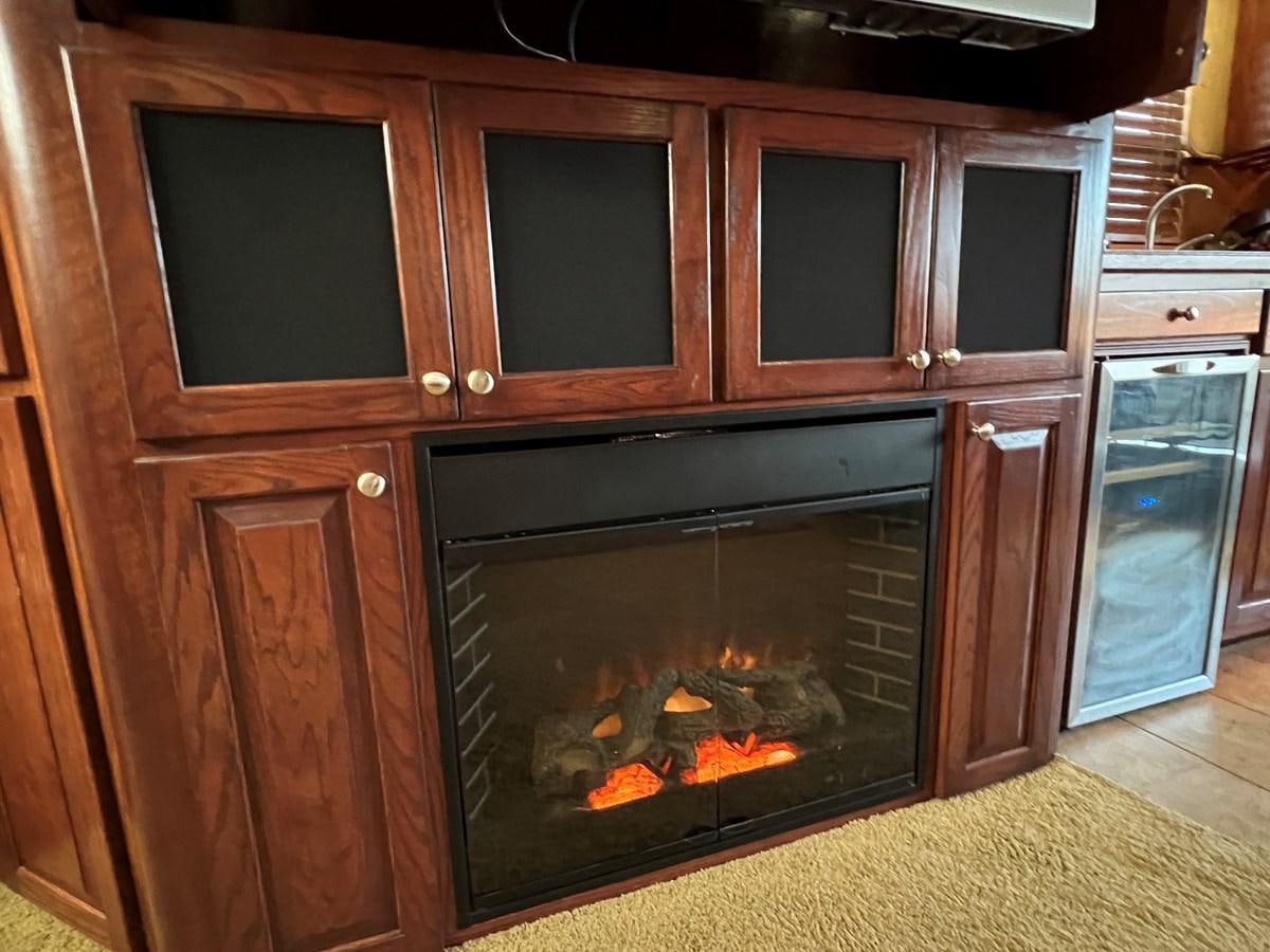 a fireplace in a kitchen aboard 2007 STARDUST 19 X 86WB NLCG Yacht for Sale