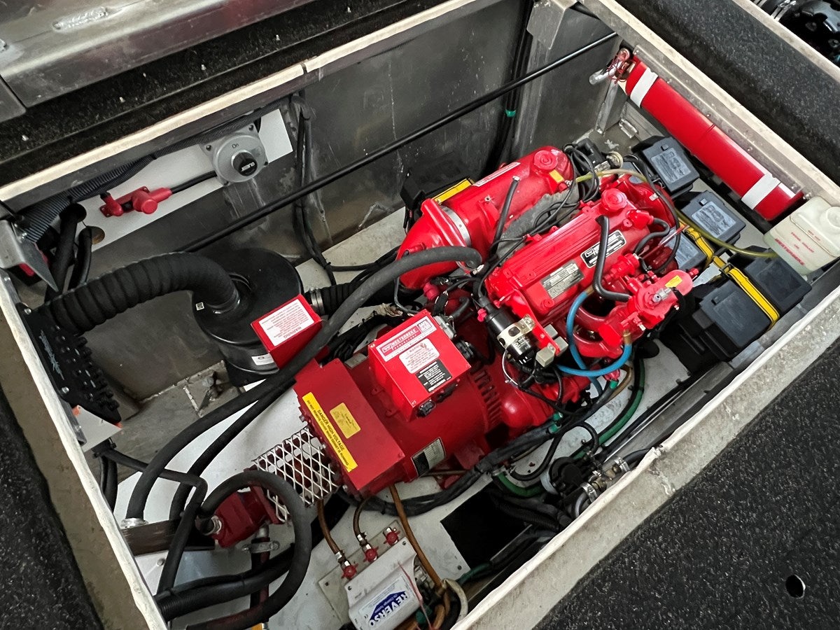a car engine with red and black wires aboard 2007 STARDUST 19 X 86WB NLCG Yacht for Sale
