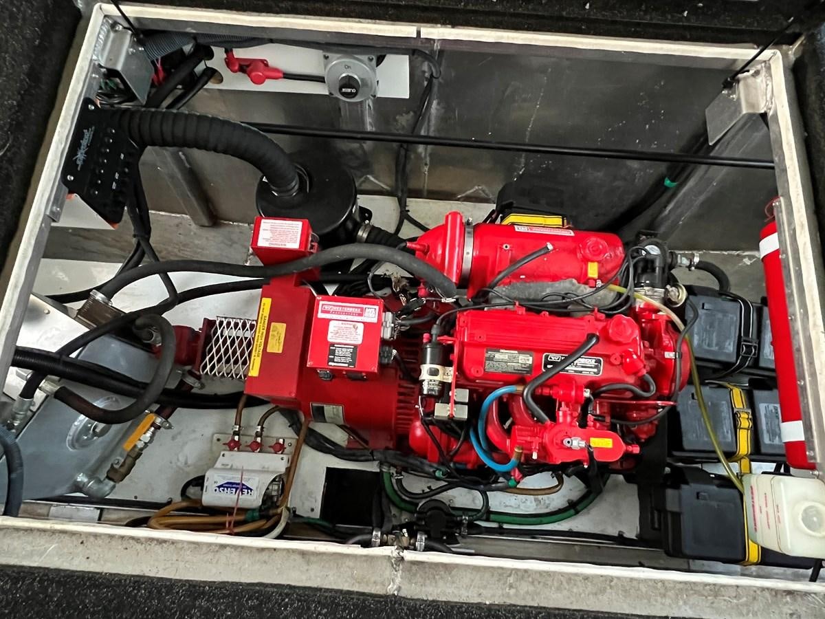 a car engine with red and black wires aboard 2007 STARDUST 19 X 86WB NLCG Yacht for Sale
