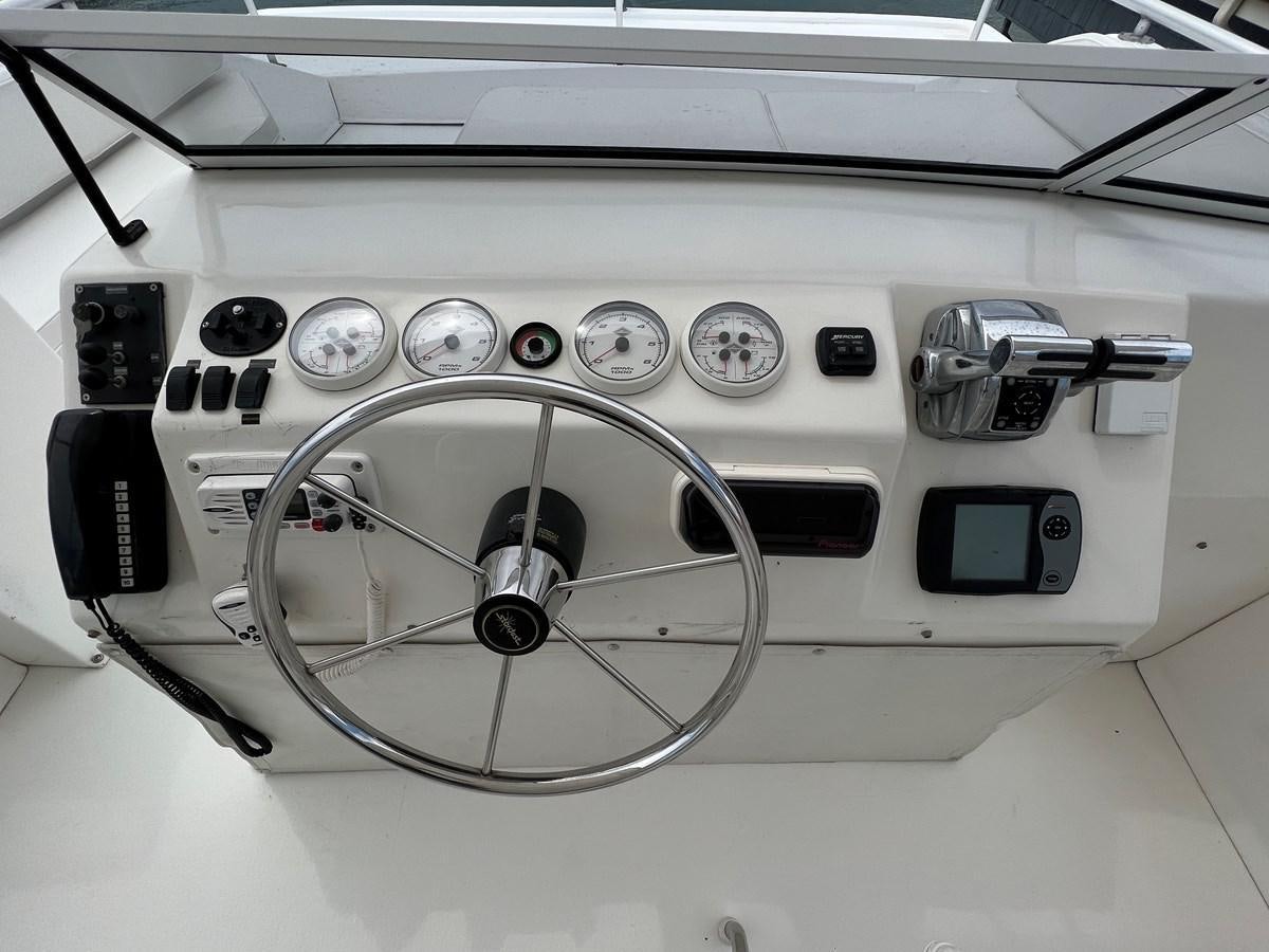 a white car with a steering wheel aboard 2007 STARDUST 19 X 86WB NLCG Yacht for Sale