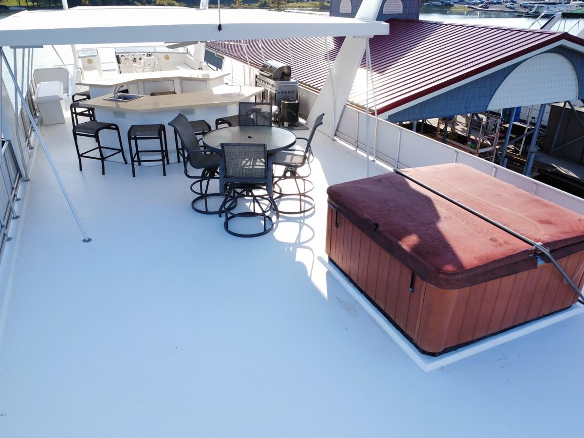 a large room with chairs and tables aboard 2007 STARDUST 19 X 86WB NLCG Yacht for Sale