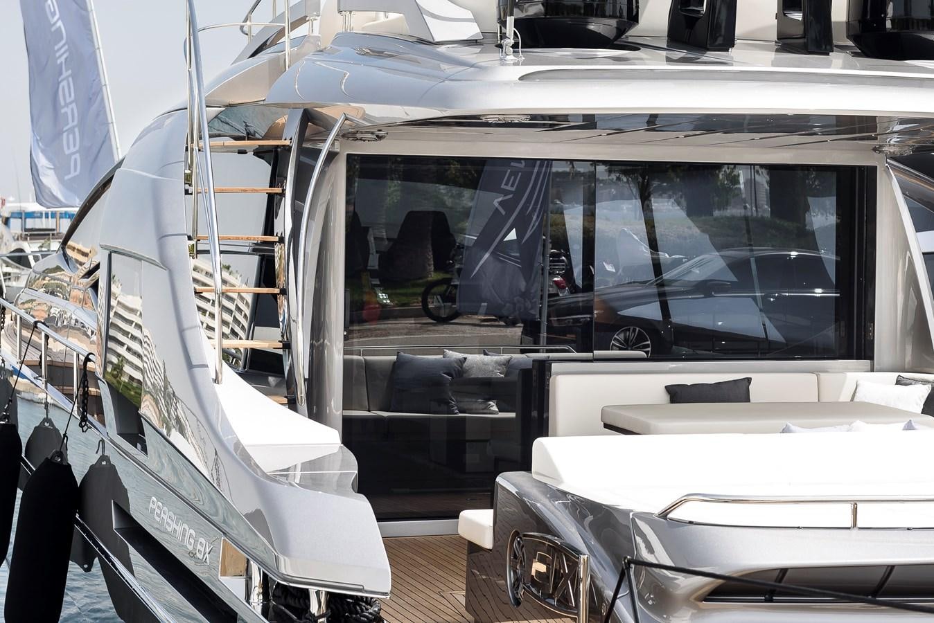 a large white boat with a ladder aboard CUCU Yacht for Sale