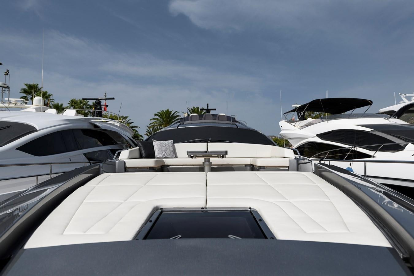 a group of white yachts aboard CUCU Yacht for Sale