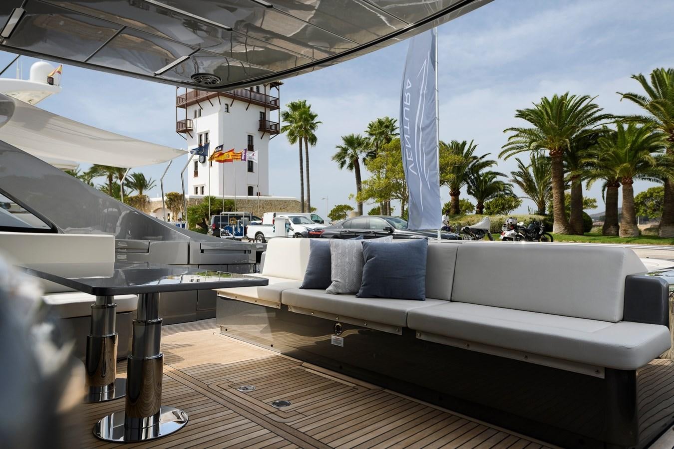 a large white couch on a deck aboard CUCU Yacht for Sale