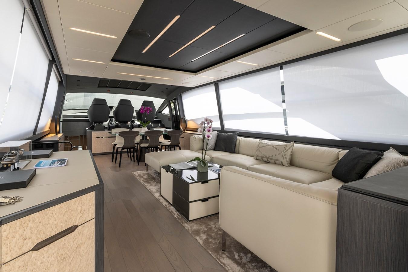 a living room with a large window aboard CUCU Yacht for Sale