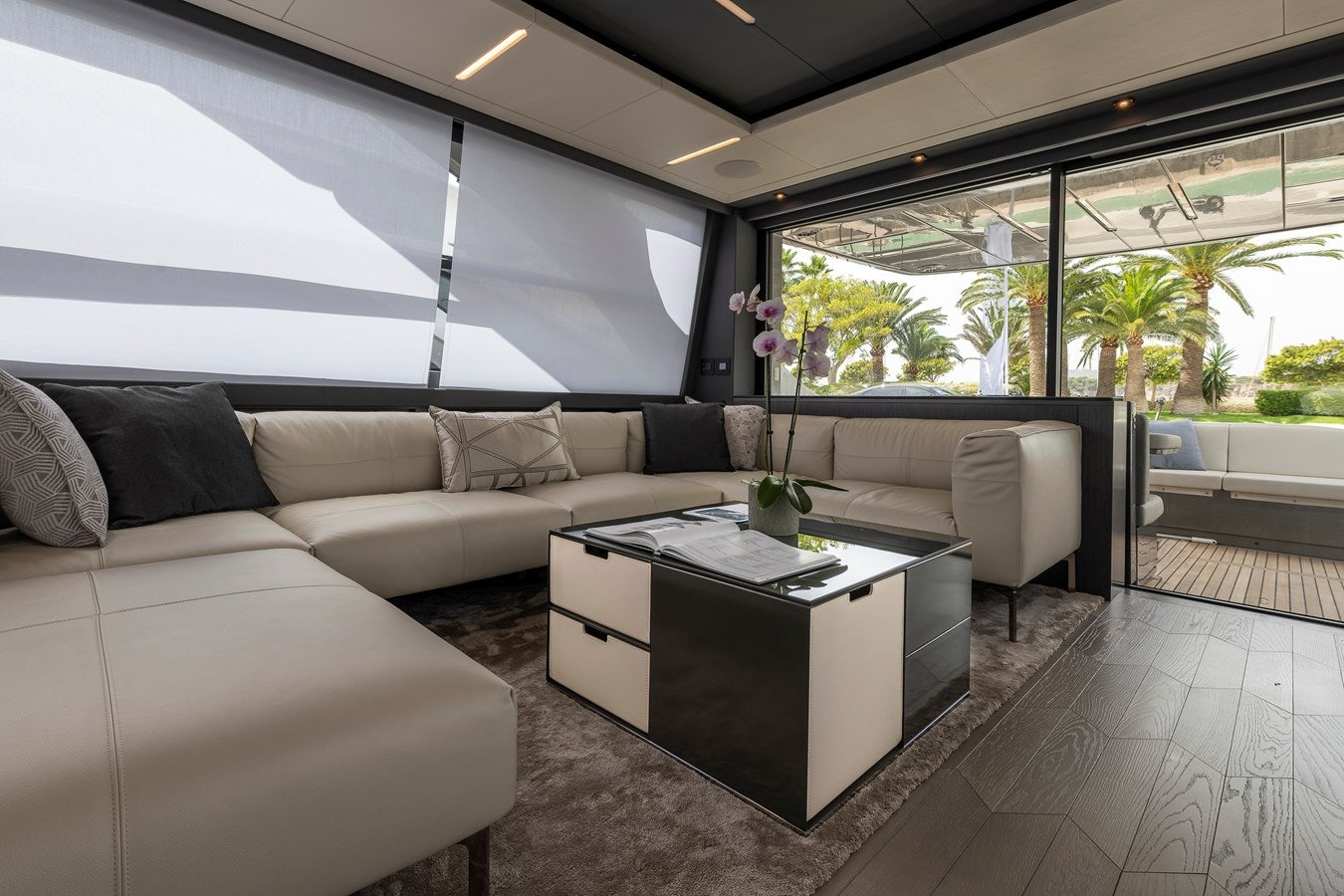 a living room with a couch and a coffee table aboard CUCU Yacht for Sale