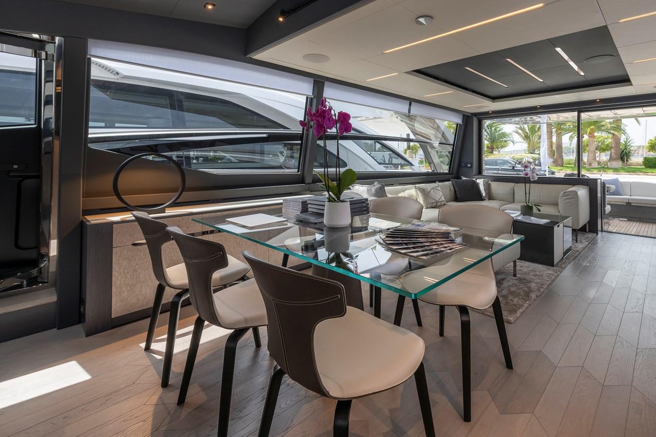 a room with a table and chairs aboard CUCU Yacht for Sale