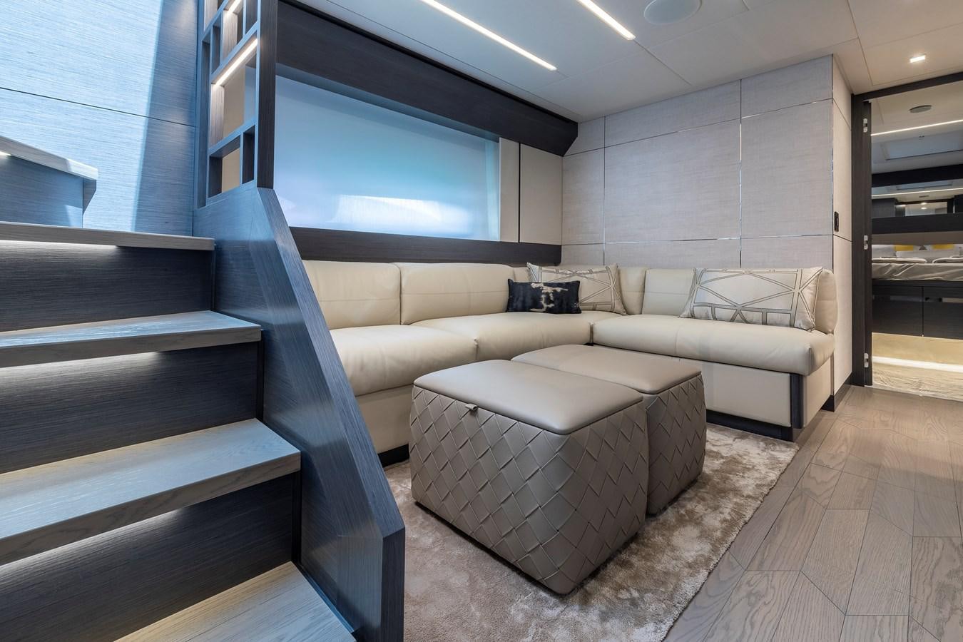a room with couches and a table aboard CUCU Yacht for Sale