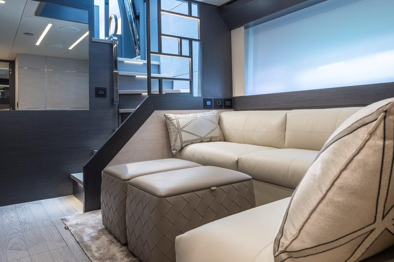 a living room with couches aboard CUCU Yacht for Sale