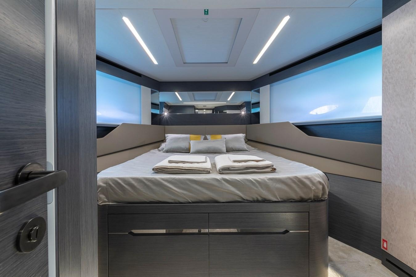 a room with a bed and a window aboard CUCU Yacht for Sale