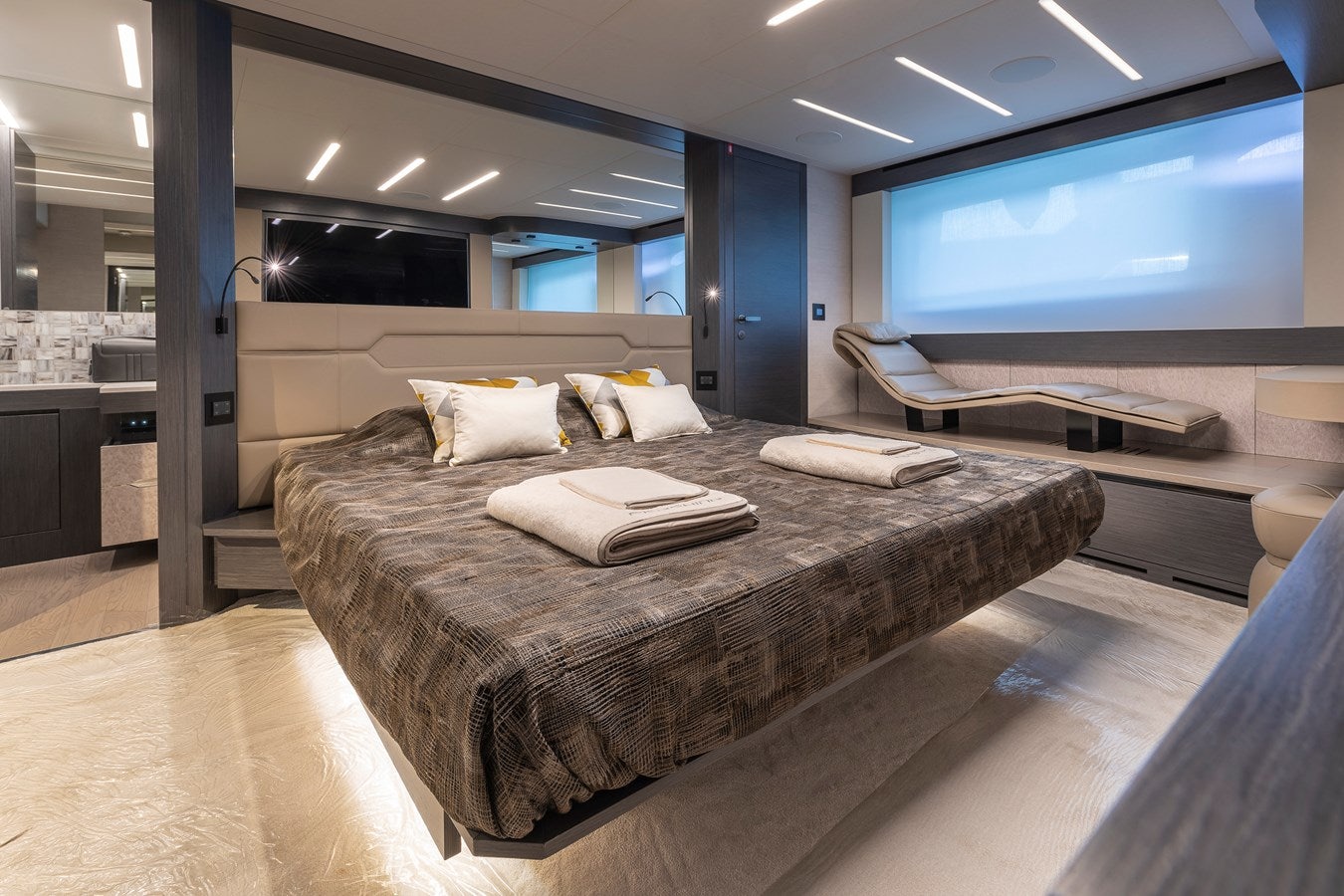 a large bed in a room aboard CUCU Yacht for Sale