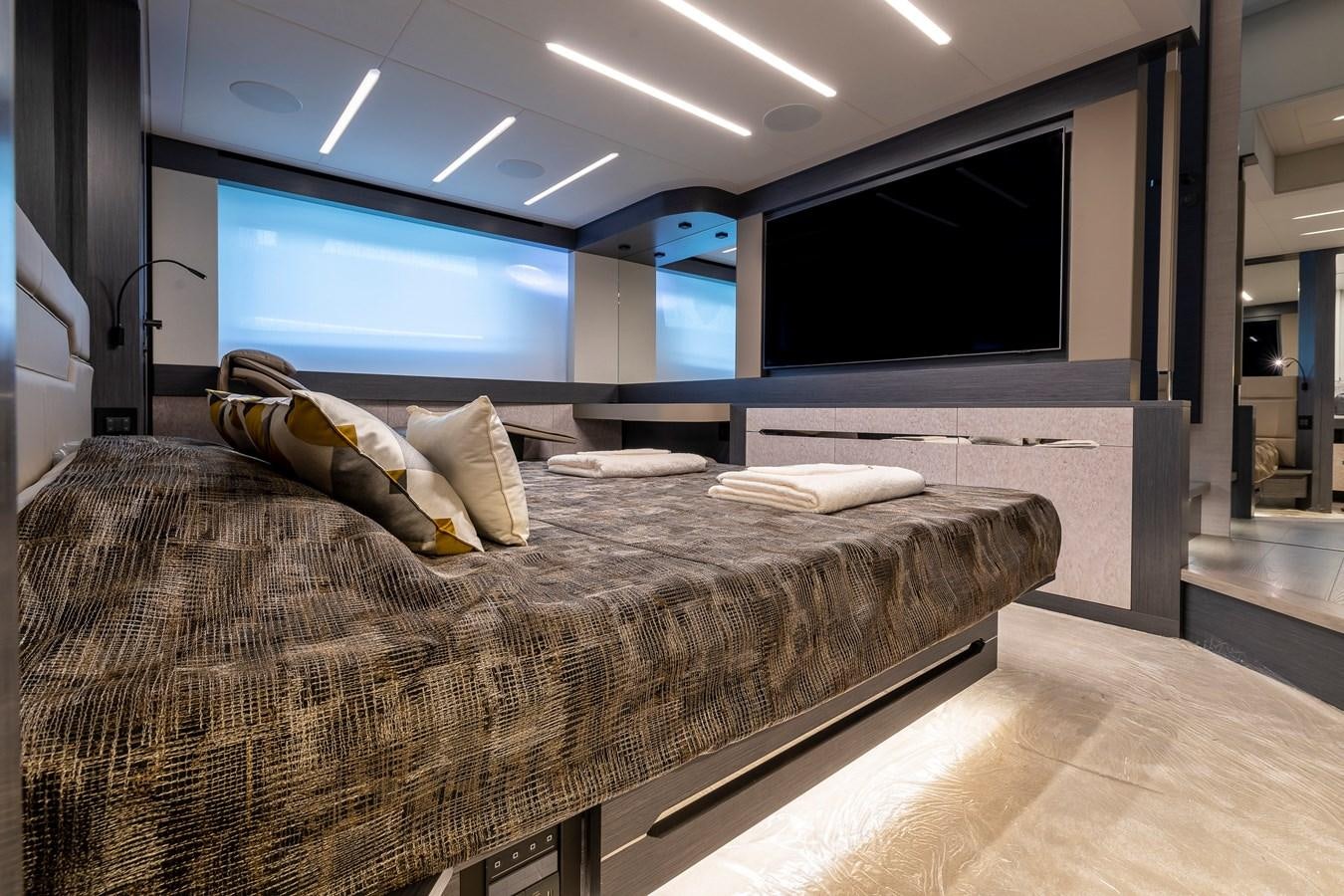 a large bed in a room aboard CUCU Yacht for Sale