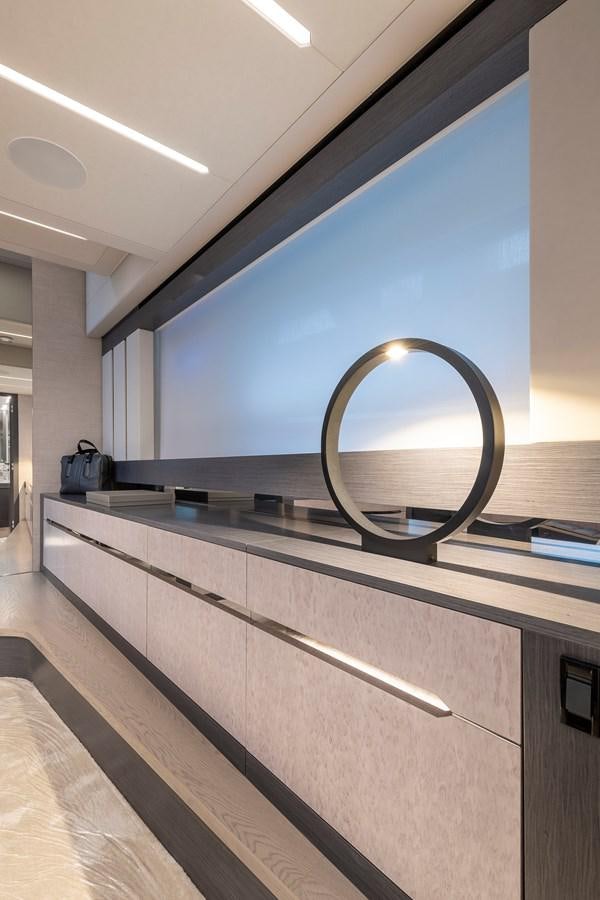 a large round mirror on a counter aboard CUCU Yacht for Sale