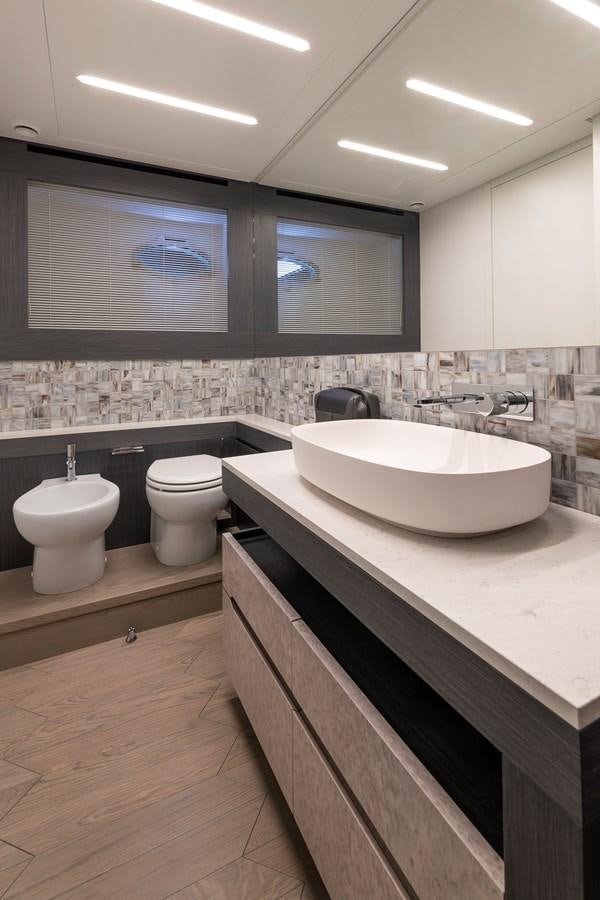 a bathroom with a large mirror aboard CUCU Yacht for Sale