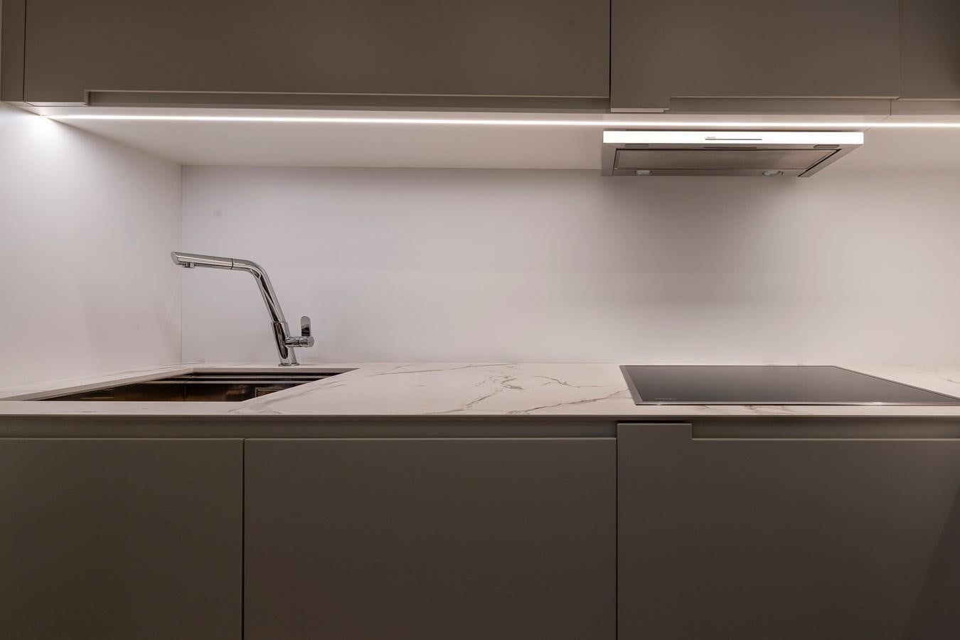 a kitchen with a sink and a faucet aboard CUCU Yacht for Sale