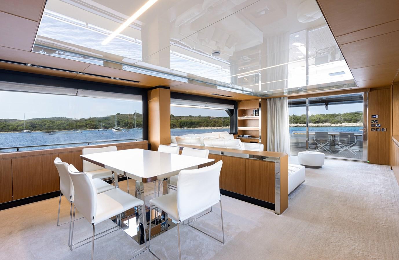 a room with a table chairs and a large window aboard NO STRESS 888 Yacht for Sale
