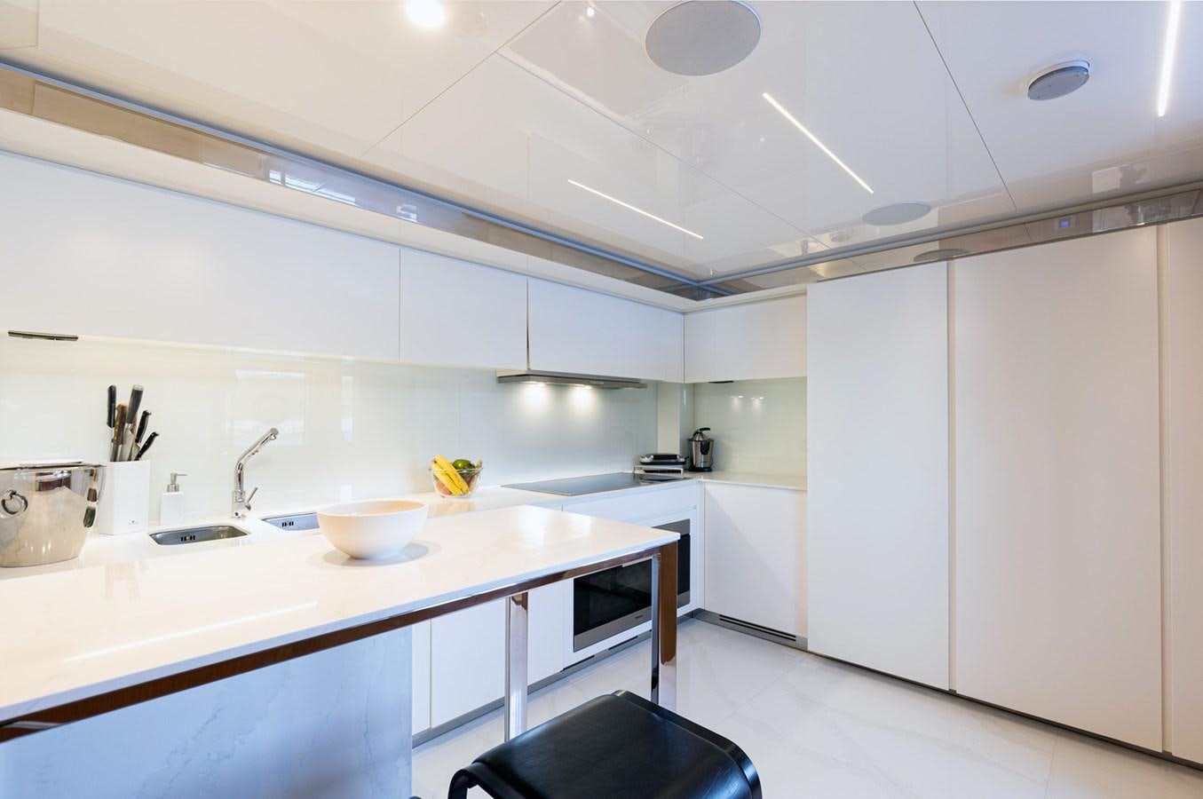 a kitchen with white cabinets aboard NO STRESS 888 Yacht for Sale