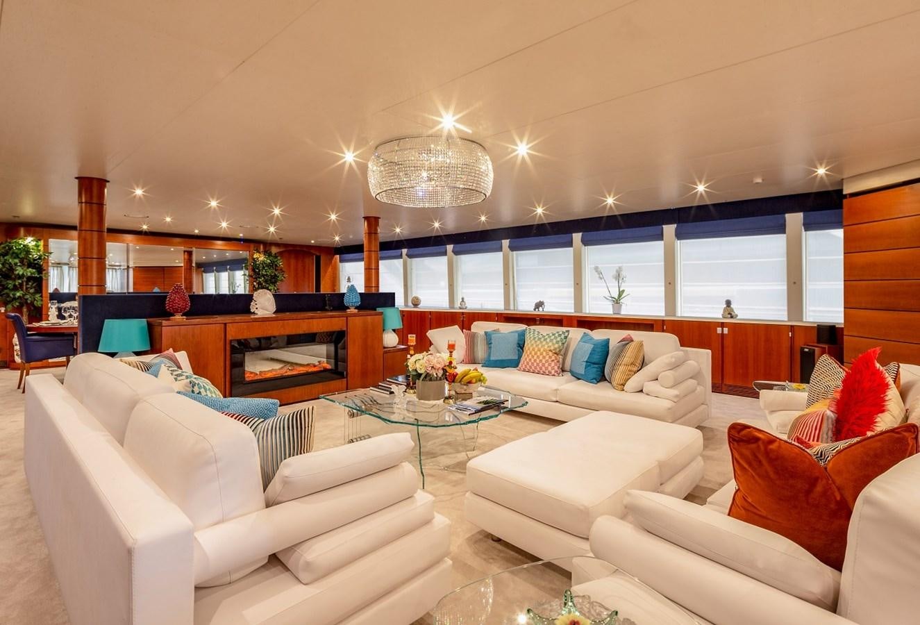 a living room with white couches aboard LUCY III Yacht for Sale
