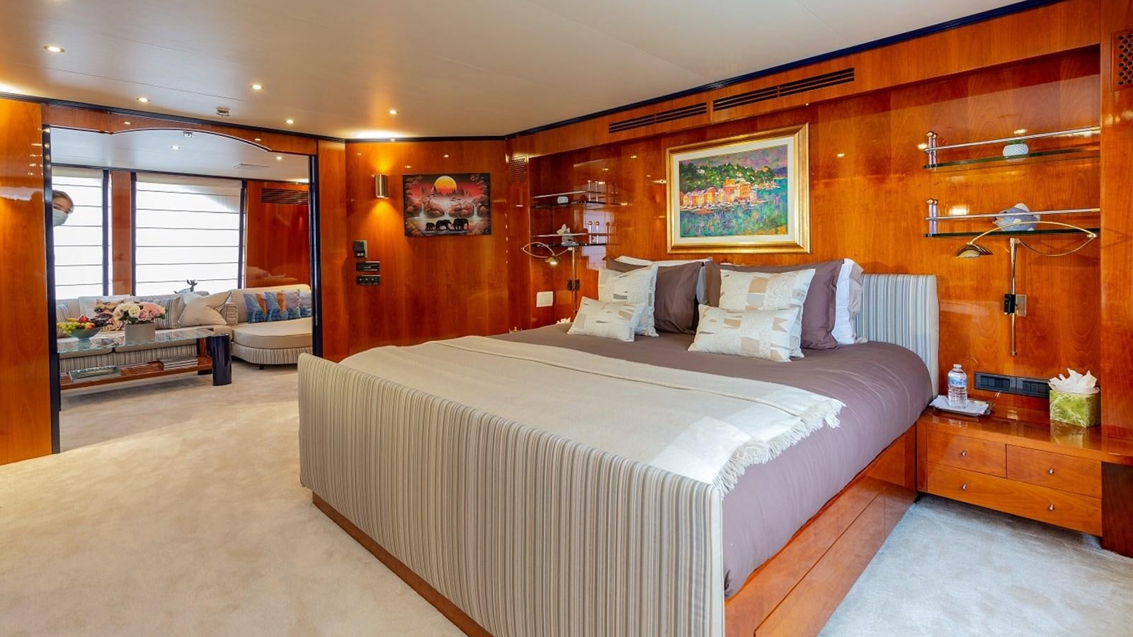 a bedroom with a large bed aboard LUCY III Yacht for Sale