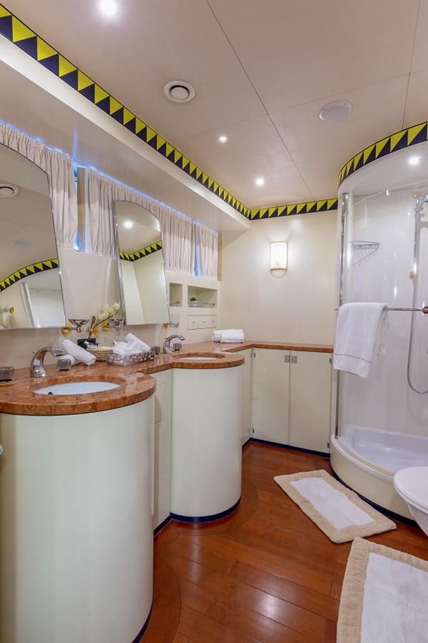 a bathroom with a sink and a mirror aboard LUCY III Yacht for Sale