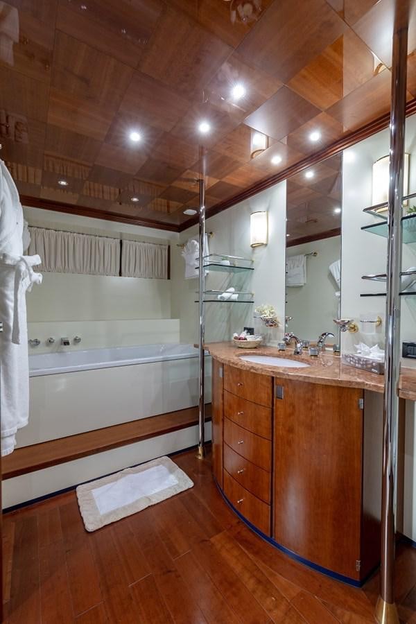 a bathroom with a sink and a mirror aboard LUCY III Yacht for Sale