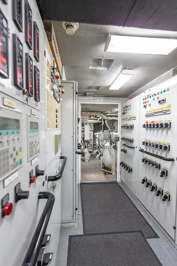 a hallway with a few doors aboard LUCY III Yacht for Sale