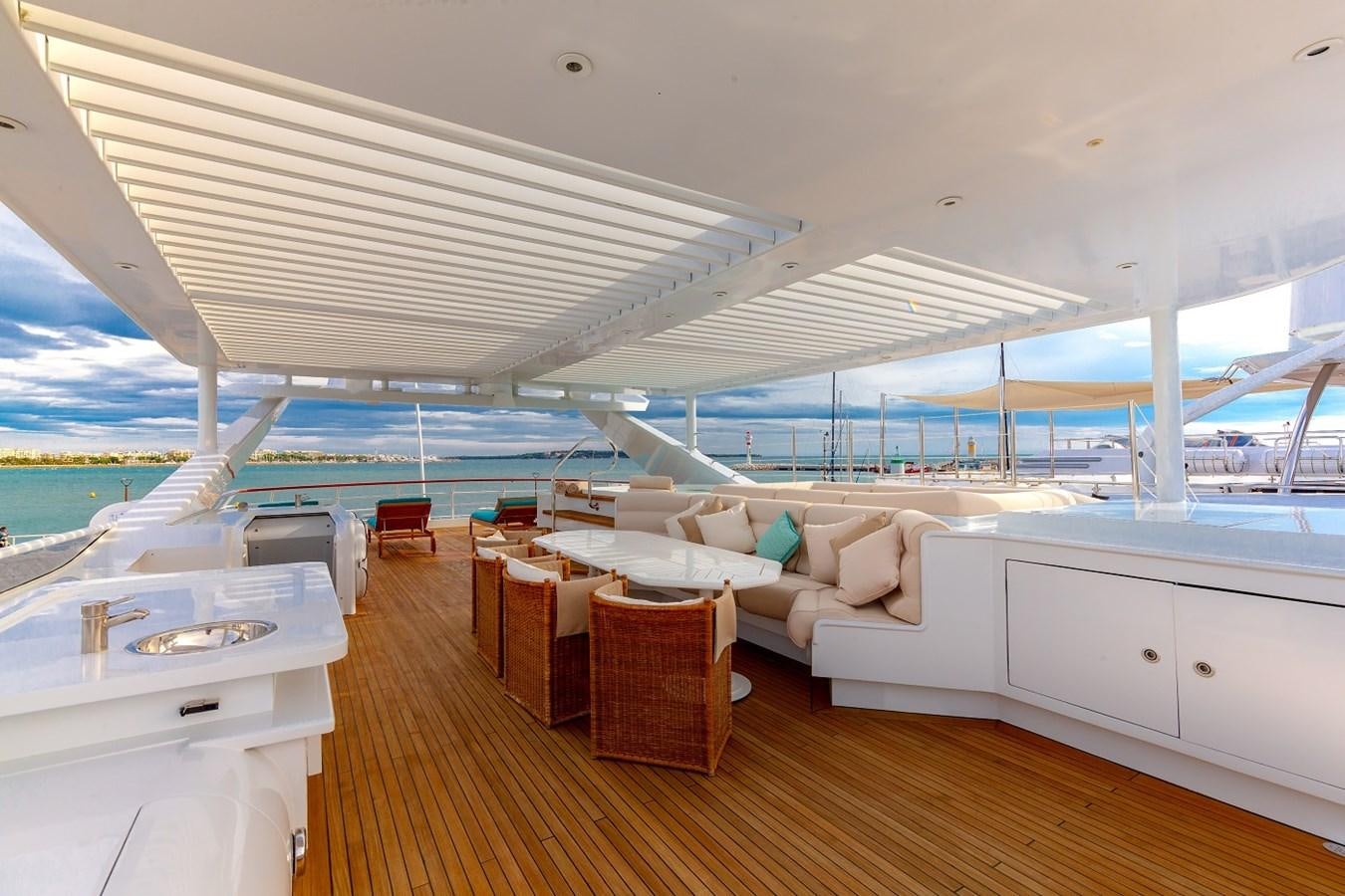 a large white boat on a body of water aboard LUCY III Yacht for Sale