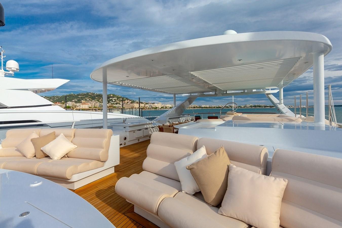 a large white boat on a large body of water aboard LUCY III Yacht for Sale